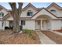 Two-story stucco townhome with Spanish tile roof and walkway at 3548 Forest Branch Dr # C, Port Orange, FL 32129