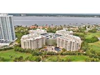 Aerial view of a condo building with water and golf course views at 4 Oceans West Blvd # 206C, Daytona Beach, FL 32118