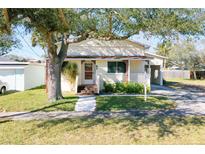 Charming yellow house with a spacious yard, perfect for a Gathering at 67 Ormond Shores Dr, Ormond Beach, FL 32176