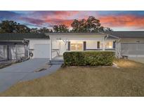 Charming single story home with well maintained landscaping and inviting front porch at sunset at 8885 Sw 95Th St # C, Ocala, FL 34481