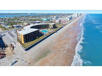 Aerial view of oceanfront hotel property with direct beach access and pool at 2301 S Atlantic Ave # 230, Daytona Beach, FL 32118