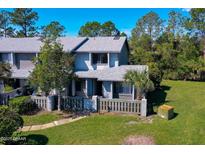 Charming two-story home with well-maintained landscaping, offering a welcoming curb appeal at 150 Limewood Pl # F, Ormond Beach, FL 32174