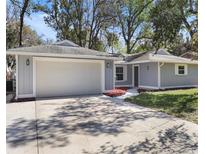 Charming one-story home featuring an attached two-car garage and a well-maintained front yard at 1011 Indian Oaks W, Daytona Beach, FL 32117