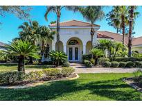 Beautiful single-story home featuring a meticulously maintained lawn, elegant landscaping, and a terracotta-tiled roof at 1317 Dovercourt Ln, Ormond Beach, FL 32174
