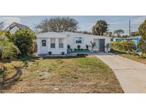 Charming single-story home with a well-maintained lawn and concrete driveway at 151 Holland Rd, Ormond Beach, FL 32176