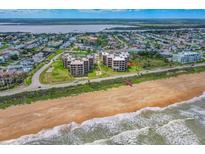 Breathtaking aerial view of a beachfront condo with ocean views and direct beach access at 3370 Ocean Shore Blvd # 206B, Ormond Beach, FL 32176