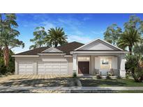Charming single-story home with a three-car garage, manicured lawn, and inviting front porch at 1720 Lake Reserve Dr, Deland, FL 32724