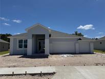 New construction exterior elevation of a single-Gathering home with a spacious three car garage at 1689 Lake Reserve Dr, Deland, FL 32724