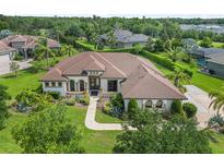 Expansive single Gathering home with lush landscaping and beautiful curb appeal in a private community at 1357 Liam Cir, Ormond Beach, FL 32174