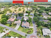 Stunning aerial view of a home with a private pool, close to shopping centers and community recreational facilities at 6 Talaquah Blvd, Ormond Beach, FL 32174