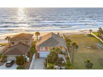 Stunning oceanfront home with a meticulously maintained lawn and direct beach access at 1504 N Atlantic Ave, Daytona Beach, FL 32118