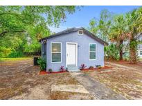 Charming bungalow with blue siding, white trim, and inviting front entrance at 603 W Miles St, Deland, FL 32720
