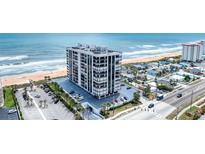 Stunning condominium building with beachfront access and ample parking, capturing the essence of luxury coastal living at 1239 Ocean Shore Blvd # 11D, Ormond Beach, FL 32176