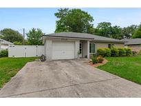 Charming one-story brick home with a single-car garage, nice lawn, and cozy curb appeal at 1719 Anniston Ave, Daytona Beach, FL 32117