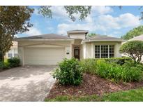 Charming single-story home with a two-car garage and well-maintained landscaping at 902 Heron Point Cir, Deland, FL 32724