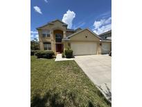 Charming two-story home with a well-manicured lawn and a spacious three car garage at 3660 Daydream Pl, St Cloud, FL 34772