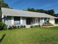 Charming single-story home with well-maintained lawn and colorful landscaping enhancing curb appeal at 1810 Western Rd, South Daytona, FL 32119