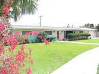 Charming single-story home with a well-manicured lawn and colorful landscaping, offering great curb appeal at 39 Benjamin Dr, Ormond Beach, FL 32176