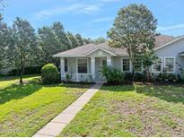 Charming single-story home with well-manicured lawn and mature landscaping at 3132 Connemara Dr, Ormond Beach, FL 32174