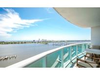 Expansive balcony view overlooking the city skyline and waterfront with comfortable outdoor seating at 231 Riverside Dr # 1602, Holly Hill, FL 32117
