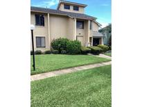 Charming townhome featuring well-maintained landscaping and a welcoming front entrance at 133 Blue Heron Dr # D, Daytona Beach, FL 32119
