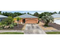 Charming one-story home featuring a well-kept yard, driveway, and neutral exterior paint scheme at 209 Falcon Ave, Edgewater, FL 32141
