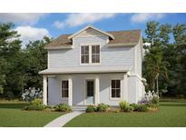 Charming two-story home with light blue siding, inviting front porch, and beautifully landscaped front yard at 10218 Dulbecco St, Orlando, FL 32827