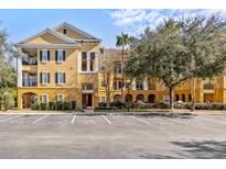Inviting yellow condo building with ample parking at 3615 Conroy Rd # 614, Orlando, FL 32839
