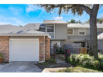 Brick townhome with attached garage and fenced-in patio at 624 Maple Oak Cir # 108, Altamonte Springs, FL 32701
