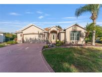 One-story home with attached garage and landscaped yard at 17112 Se 71St Lewisfield Ter, The Villages, FL 32162