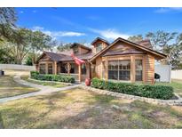 Two-story home with brick and wood siding at 18033 Rose St, Groveland, FL 34736