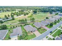 Aerial view of homes on a golf course community at 4513 Antietam Creek Trl, Leesburg, FL 34748