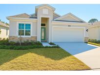 Charming single-story home with a well-manicured lawn and a two-car garage at 2022 Wallingford Loop, Mount Dora, FL 32757