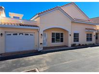 Front view of charming condo with attached garage and attractive landscaping at 255 David Walker Dr # F5, Tavares, FL 32778