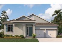 Charming single-story home featuring a two-car garage, well-maintained lawn, and inviting curb appeal at 5131 Firebush Dr, Apopka, FL 32712