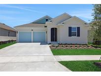 Charming single-Gathering home with a two-car garage and well-maintained landscaping at 5131 Firebush Dr, Apopka, FL 32712