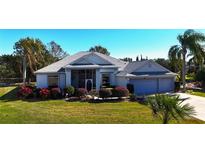 Single-Gathering home with two-car garage and lush landscaping at 24308 Belle Mede Dr, Leesburg, FL 34748