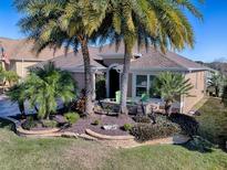 Attractive single-Gathering home with landscaped yard and palm trees at 3281 Bell Ter, The Villages, FL 32163