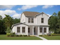 Two-story home with white siding, gray roof, and a landscaped lawn at 10049 Ballast Dr, Orlando, FL 32827