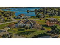 Luxury home on lakefront lot with expansive water views and lush landscaping at 17640 Las Brisas Ct, Winter Garden, FL 34787