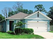 Charming single-story home showcasing its well-maintained lawn and attached two-car garage at 2295 Delhi Pl, Sanford, FL 32771