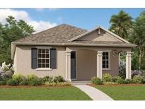 One-story home with neutral siding, a covered entry, and a neatly landscaped lawn at 5121 Blanket Flower St, Apopka, FL 32712