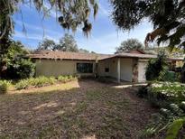 Single story home with a large yard and carport at 509 Jackson St, Eustis, FL 32726