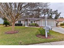 Single-story home with landscaped lawn and attached garage at 5520 Nw 18Th St, Ocala, FL 34482