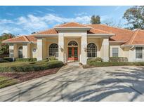 Inviting one-story home with a tile roof and lush landscaping at 1286 Prince Ct, Lake Mary, FL 32746