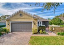 Beautiful one-story home with a two-car garage and well-manicured lawn at 370 Salt Marsh Ln, Groveland, FL 34736