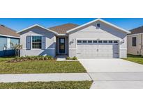 Curb appeal abounds in this charming single story home featuring a two car garage and lush landscaping at 5792 Timber Meadow Way, St Cloud, FL 34771