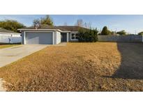 Single-story house with attached garage and basketball hoop at 8 Dogwood Circle Pl, Ocala, FL 34472