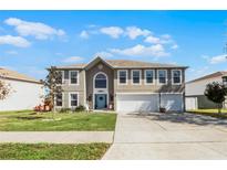 Charming two-story home with well-maintained lawn, three-car garage, and inviting curb appeal at 3215 Park Branch Ave, Clermont, FL 34711