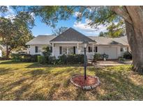 Charming single-story home with a well-maintained lawn and cozy front porch at 8862 Sw 92Nd St # D, Ocala, FL 34481